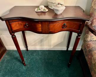 Serpentine-front console table.