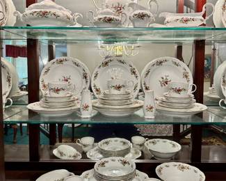 Haviland "Moss Rose" china.  Includes: 13 bread plates, 13 dessert bowls, 13 cups&saucers, 11 dinner plates, 6 soup bowls, 4 salad plates, 1 tureen, 1 tea pot, 1 platter, 1 gravy bowl with attached plate, 1 set sugar&creamer, 1 vegetable server, 1 covered butter dish, 1 set salt&pepper shaker.