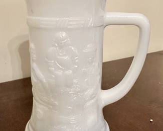 Vintage milk glass beer mug with tavern scene.