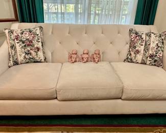 Chesterfield style tufted couch.