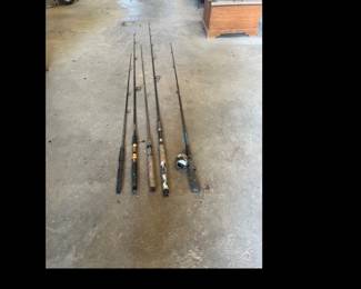 group of four fishing rods plus One Zep Co, Rod and Real