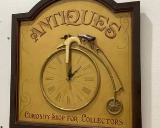 Antiques sign and clock with Penny-Farthing