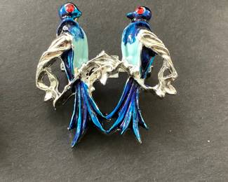 One of 2 bluebird enameled brooches
