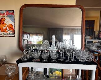 Wood framed wall mirror is 41” x 31” with rounded corner corners