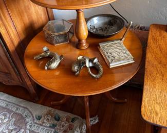 Two tier wood table is 22 inch diameter and 14 inch diameter on top