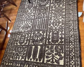 Hand woven, beige and brown and gray rug is 51 x 82“