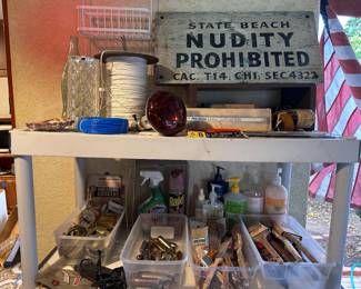 Painting, supplies, canning supplies and an old state beach, nudity prohibited sign for your more adventurous guests