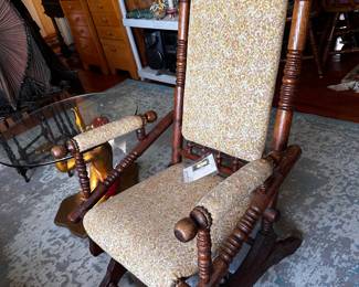 Glider rocker with upholstery, rough on arms and top, but American classic
