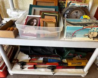 Club wheel locks with keys, chain saw, water pump, picture frames, saw blades