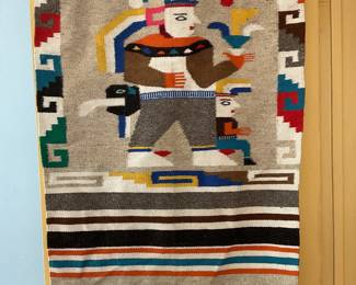 Mexican woven blanket top is wrapped over door