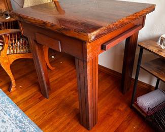 Game table shown with top on top lifts off to reveal backgammon
