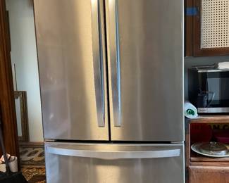 Whirlpool stainless steel refrigerator is 36 inches wide and 31 inches deep