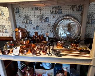 Copper bowls and pans with brass handles, stainless interiors, copper openers measuring cups napkin, rings, hand, hammered fork, and knife, fork and spoon serving sets, etc.