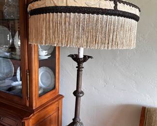 Fancy table lamp is reported to be from Hearst Castle, and we have included the information about that for you in another photograph