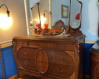 Dresser that goes with bedroom set again with beautifully carved swans is 51 inches across and 24 inches deep please note etching on three sections of beveled mirrors, one large, one wide top drawer and two lower roomy drawers