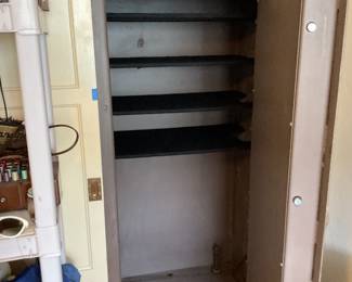 Safe shown open with added shelves that can be removed for felt lined shelves included, and bolts that go into the floor partially unbolted for you