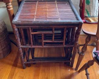 Rattan table shown stacked three separate by lifting up