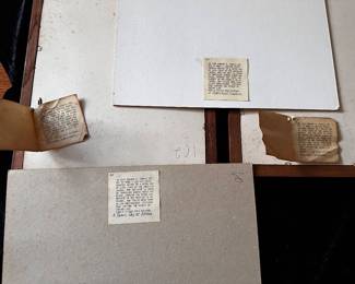 Backs of the four Edward Curtiss Indian photographs with original tags and descriptions