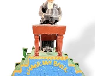 Vintage Cast Iron Magician Coin Bank