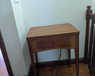 sewing table. Has the sewing machine, but needs a tune up