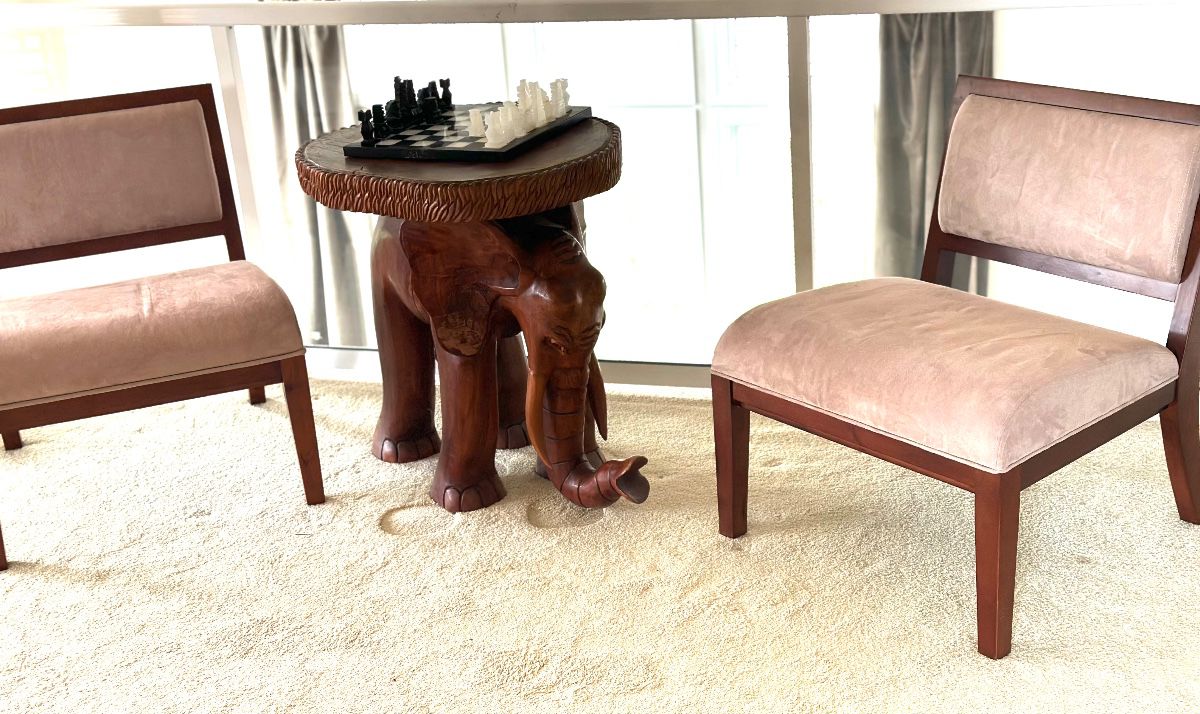 Hand carved wooden Elephant accent table ( 2' 5" T x 2' 4" W) , modern armless accent chairs by Sitcom chairs,
