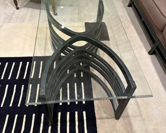 Glass top coffee table and matching end table with wood slat detailing , contemporary geometric rug