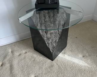 Sculptural accent sofa and end table ,postmodern stone like base and glass top 