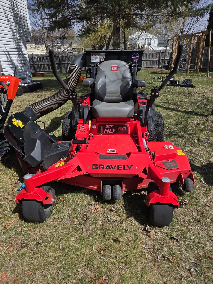 Gravely ZT HD-60 zero-turn mower, a heavy-duty residential lawnmower designed for large properties.  Cutting Deck: Features a 60-inch fabricated cutting deck for wide cutting passes. 