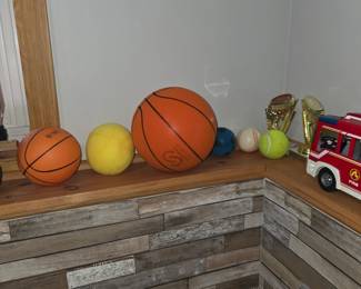 Basketballs, softballs, trophies
