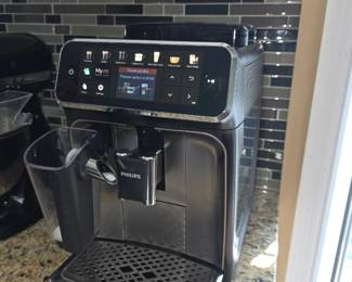 Philips 4300 Series Fully Automatic Espresso Machine with LatteGo, featuring an intuitive touch display and a 100% ceramic grinder. 