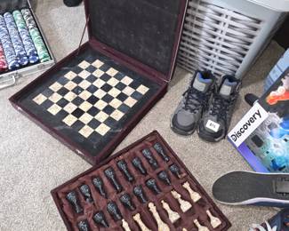 handcrafted stone chess pieces in a fitted velour case.