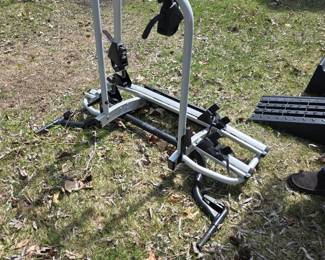  Rear-mounted car bike rack. Compatibility: Designed for specific vehicles, such as certain BMW X5 models or motorhomes, often attaching directly to the rear wall or internal bumper mounts. 