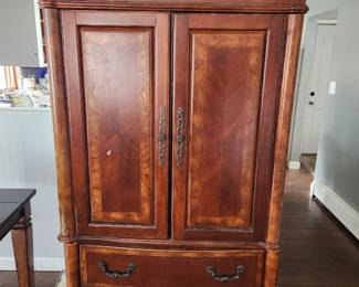 Armoire - the doors slide in on sides. 