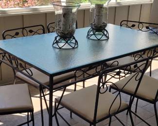 Wrought iron glass top table with 6 chairs