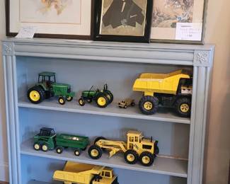 bookcase, John Deere and Tonka diecast trucks, assorted Asian artwork