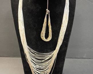 sterling silver necklace with matching bracelet and small gold beads