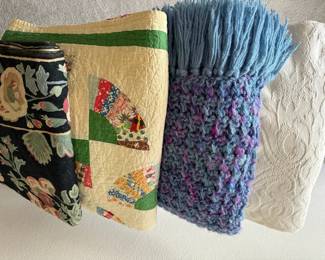 Textile Collection with Quilts, Floral Fabric, and Handwoven Throw