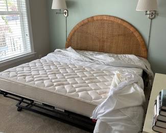 B11 - $250. Wicker Headboard used as a day bed. Twin size mattress with pop up trundle that makes it king sized. 