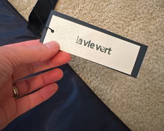 B45 - $25. La Vie Vert Puzzle Board with Padded Cover. Looks brand new with tags. 