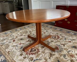 B12 - $600. Teak Dining Table with 2 leaves. Table is 42" round x 29.5" tall. 2 - 20" leaves included. 1 leaf needs refinishing (if you want - just a dark heat spot) 