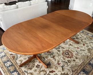 B12 - $600. Teak Dining Table with 2 leaves. Table is 42" round x 29.5" tall. 2 - 20" leaves included. 1 leaf needs refinishing (if you want - just a dark heat spot) 