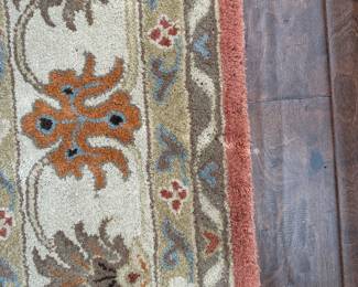 B23 - $75. Surya "Caesar" 100% Wool Area Rug. 8' x 11'. There is some damage from moths. See photo. 