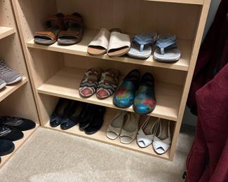 B76 - $30 PAIR of Pressed Wood Shelves. Used for shoes but would work for books. Shelves are adjustable. 