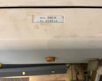 B84 - $200. Singer Knitting Machine. Model 360K. With a box of attachments. 