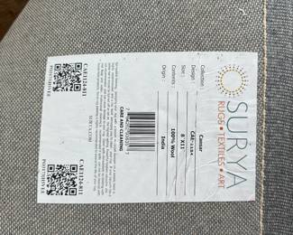 B23 - $75. Surya "Caesar" 100% Wool Area Rug. 8' x 11'. There is some damage from moths. See photo. 