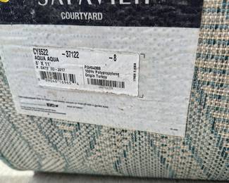 B17 - $40. Safavieh "Aqua Aqua" outdoor area rug. Measures 8' x 11'. 