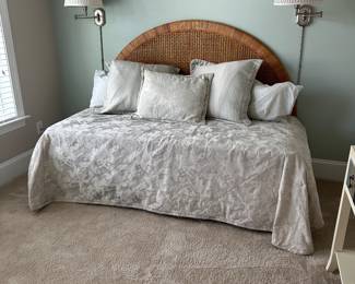 B11 - $250. Wicker Headboard used as a day bed. Twin size mattress with pop up trundle that makes it king sized. 