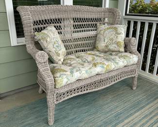 B15 - $75. Plastic Wicker Loveseat. Used on a covered porch. Bench is sturdy, Cushion has damage on the bottom from a squirrel. 