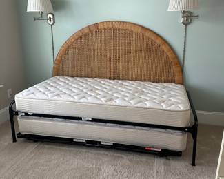 B11 - $250. Wicker Headboard used as a day bed. Twin size mattress with pop up trundle that makes it king sized. 