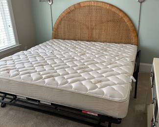 B11 - $250. Wicker Headboard used as a day bed. Twin size mattress with pop up trundle that makes it king sized. 